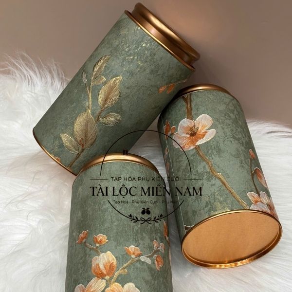 Lon tròn hoa nổi to xanh 200g